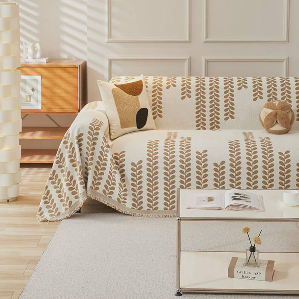 Sofföverdrag med bladmönster och fransar – elegans och komfort