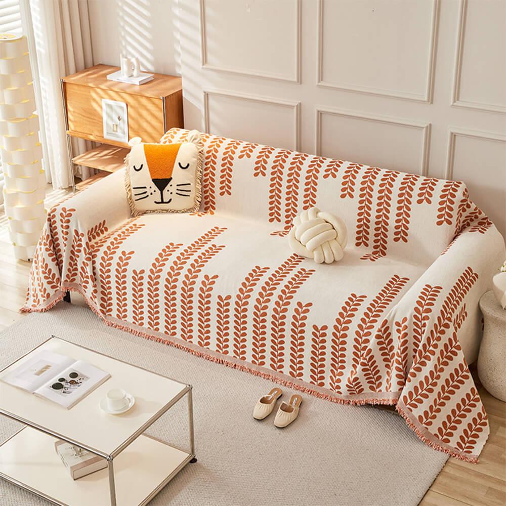 Sofföverdrag med bladmönster och fransar – elegans och komfort 