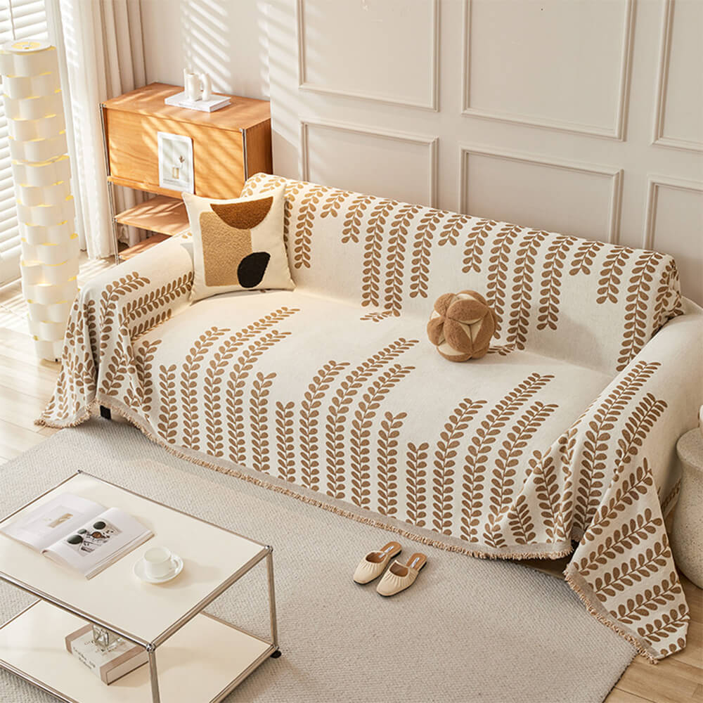 Sofföverdrag med bladmönster och fransar – elegans och komfort 